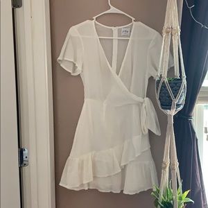 White crossover short sleeved wrap dress